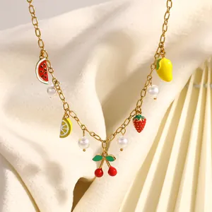 Close-up detail of 18K gold-plated stainless steel necklace with colorful fruit charms.