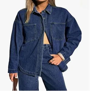 Oversized washed blue denim jacket for women featuring twin chest pockets and button front
