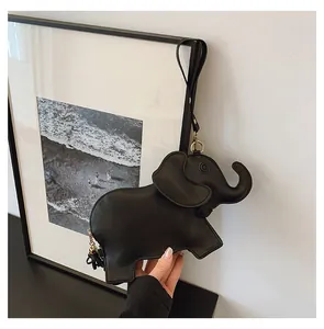 Close-up of a cute black elephant-shaped PU leather handbag with detailed stitching.