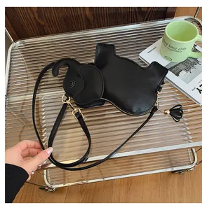 Detailed view of a cute black elephant-shaped PU leather crossbody bag with tassel.