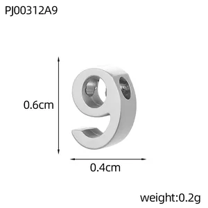 Detailed macro shot of number 9 stainless steel charm with 0.6cm x 0.4cm dimensions.