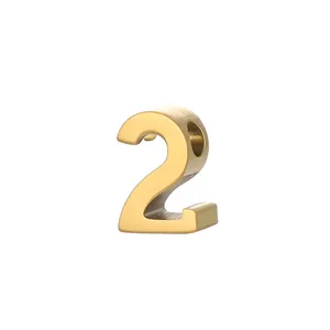 Detailed close-up view of a golden stainless steel number 2 pendant for DIY jewelry