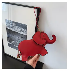 Detail view of red elephant-shaped PU leather cartoon handbag for women.