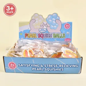 Colorful and squishy pearl shaped stress relief toys presented in a blue display box