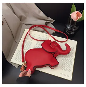 Detailed view of a cute red elephant-shaped PU leather crossbody bag with a tassel