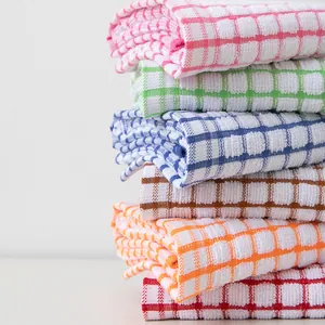 Stack of colorful checkered cotton tea towels with absorbent waffle texture display