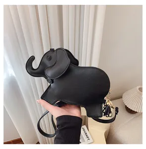 Detailed close-up of a cute black elephant shaped pebbled PU leather crossbody bag