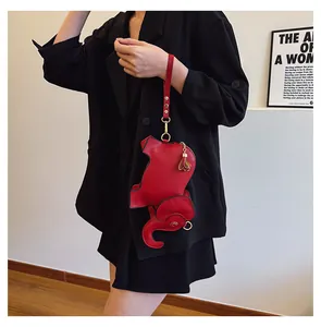 Cute red elephant-shaped PU leather wristlet bag for women, stylish lifestyle detail