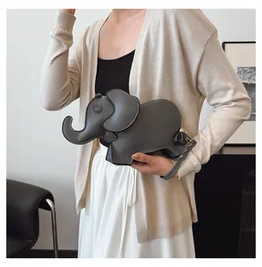 Cute elephant-shaped gray PU leather handbag shown with model for size reference