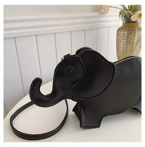 Detailed close-up of a black elephant-shaped PU leather crossbody bag with long strap