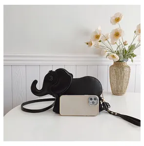 Cute black elephant PU leather crossbody bag compared with a smartphone for size.