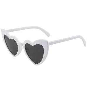 Trendy white heart-shaped sunglasses for women with dark lenses and durable frames