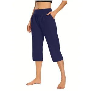 Detailed view of women's navy blue stretch casual cropped pants with side pockets