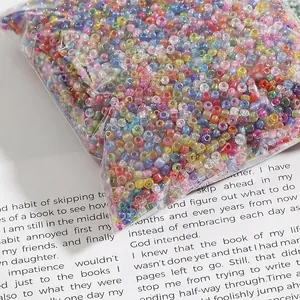 Assorted colorful iridescent glass seed beads for DIY jewelry making in bulk bag