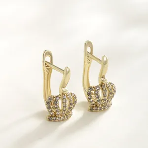 Elegant crown-shaped hoop earrings with gold plating and sparkling cubic zirconia.