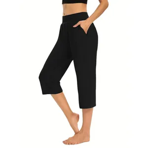 Detailed view of women's black high-waisted loose capri pants with side pockets
