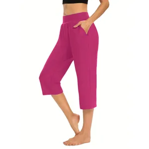 Side profile of women's fuchsia loose cropped leisure pants featuring side pockets