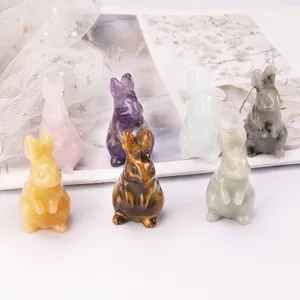 Hand-carved natural crystal rabbit figurines in various gemstones for Easter decor