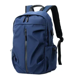 Premium navy blue minimalist men's casual backpack with laptop compartment and USB port.
