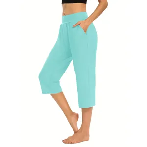 Detail view of light blue women's cropped jogger pants with functional side pockets