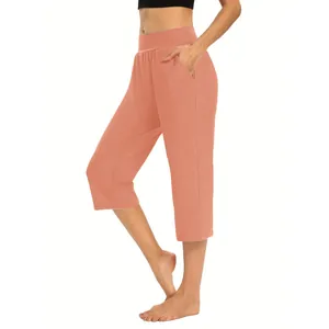 Coral peach high-waisted women's capri yoga pants with functional side pockets
