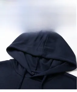 Close-up detail of the hood and neckline on a navy blue men's pullover hoodie sweater