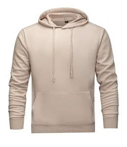 Close-up of a men's beige knitted hoodie with drawstring and kangaroo pocket