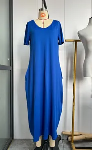 Elegant solid blue short sleeve maxi dress with side pockets on dress form mannequin