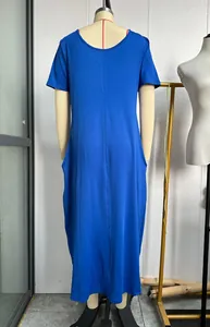 Back view of blue short sleeve maxi dress with pockets on a mannequin