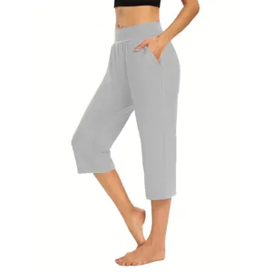 Detail view of women's light gray loose elastic sports casual capri pants with pockets.