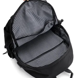 Interior view of black casual backpack with striped lining and compartments