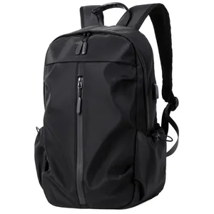 Modern minimalist black men's travel backpack and laptop bag featuring USB port