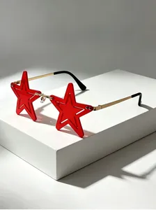Detail view of red star-shaped sunglasses with gold metal arms for party decor