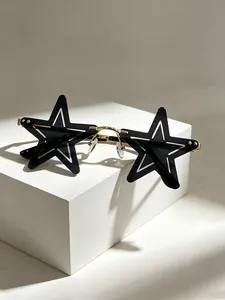 Close-up of novelty star shaped sunglasses with gold metallic frame and dark lenses