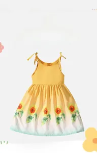 Close-up detail of a yellow sleeveless cotton dress featuring vibrant sunflower prints at the hem