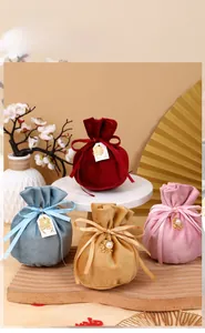 Elegant round velvet drawstring bags with bow and happiness charm for wedding favors