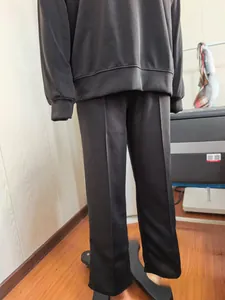 Close-up of black knitted sweatshirt and wide-leg pants casual two-piece set on mannequin