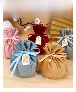 Close-up of elegant velvet drawstring gift bags in assorted colors for wedding favors