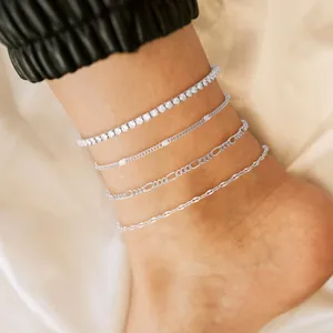 Silver-toned waterproof anklet set featuring tennis and Cuban links on ankle