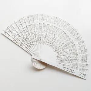 Elegant white hollow-out wooden folding fan with intricate floral floral carvings for weddings