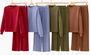 Detailed view of knitted loungewear set featuring sweatshirt and wide-leg pants in multiple colors