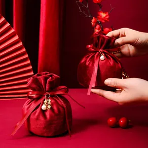 Red velvet round drawstring favor bag with golden Double Happiness pendant