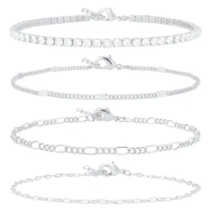 Set of four silver-tone chain anklets including tennis, Figaro, and textured link styles.