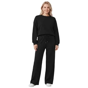 Casual black two-piece knitted tracksuit featuring a long sleeve sweatshirt and wide-leg pants