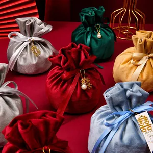 Elegant round velvet drawstring gift bags with ribbons for wedding and festive favors