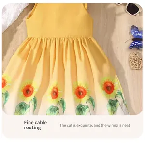 Detail view of girl's yellow summer dress with quality stitching and sunflower print