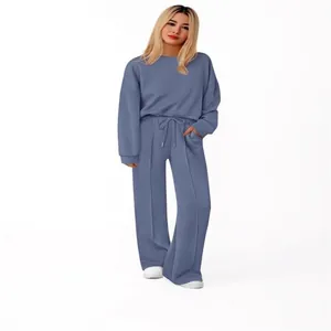 Casual women's two-piece knitted lounge set featuring blue sweatshirt and wide-leg pants