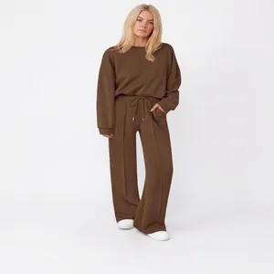Women's brown two-piece knit lounge set with sweatshirt and wide-leg pants