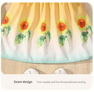 Detail view of sunflower pattern and hem stitching on girls' summer cotton dress