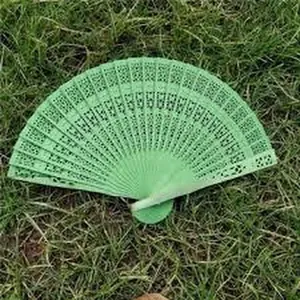 Elegant light green hollow carved wooden folding fan for wedding favors and dance